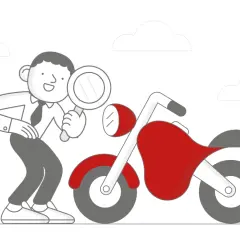 Człowiek z lupą bada czerwony motocykl, zastanawiając się, ile kosztuje przegląd motocykla.